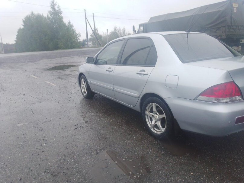 Лансер 9 серебристый рест