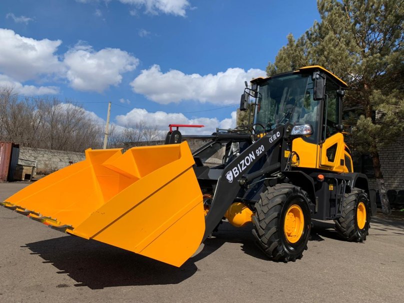 Bizon 777 экскаватор погрузчик