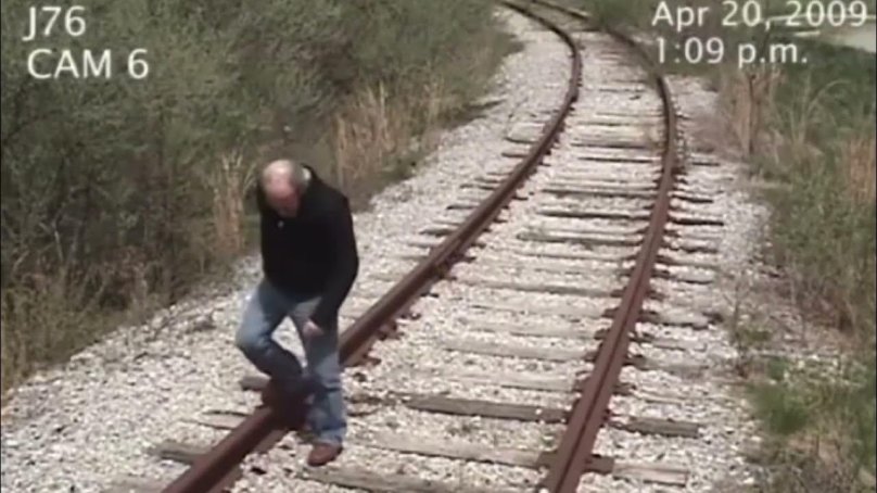 A train hits man GIF